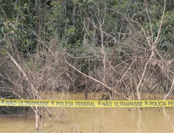  ?? Photo / AP ?? Police tape cordons off the area in Amazonas state where Bruno Pereira and British journalist Dom Phillips disappeare­d.