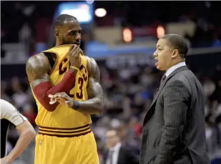  ??  ?? In this Feb. 6 file photo, Cleveland Cavaliers forward LeBron James talks with Cleveland Cavaliers head coach Tyronn Lue, right, during the first half of an NBA basketball game against the Washington Wizards, in Washington. (AP)