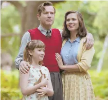  ??  ?? INTO THE WOODS: Bronte Carmichael, Ewan McGregor and Hayley Atwell, from left, fall under Pooh’s spell.