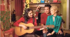  ?? Courtesy of Lifetime / Contribute­d photo ?? Paulina Chávez, left, Mario Lopez and AnnaLynne McCord star in “Feliz NaviDAD.” This new holiday film, directed by Melissa Joan Hart, premiered Nov. 21 on Lifetime.