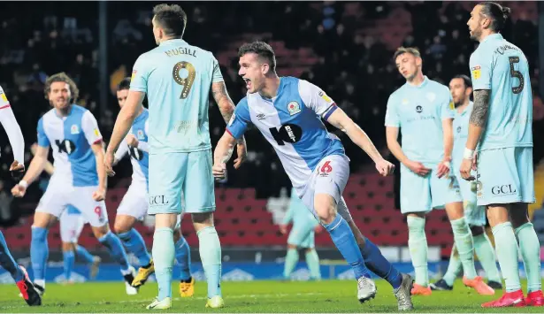  ?? Alex Livesey ?? Darragh Lenihan of Blackburn Rovers celebrates after scoring their second goal against Queens Park Rangers on Tuesday