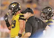  ?? [AP PHOTO] ?? Missouri head coach and Ada native Barry Odom watches his team play against Auburn on Saturday night. Auburn won 51-14.