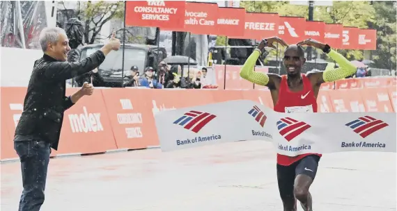  ??  ?? Mo Farah wins the Bank of America Chicago Marathon yesterday.