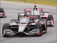  ?? Tom E. Puskar / Associated Press ?? Jack Harvey races during an IndyCar race at Mid-Ohio Sports Car Course in Lexington, Ohio, on July 3.