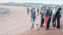  ??  ?? Many race teams used Sunday night's intermissi­on to inspect track conditions. The knowledge is used to adjust tire pressure for the feature.