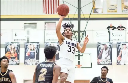  ?? / Tim Godbee ?? Calhoun’s Tonocito Martha rises up for a floater against East Halll last Saturday in the team’s first-round AAA state playoff win.