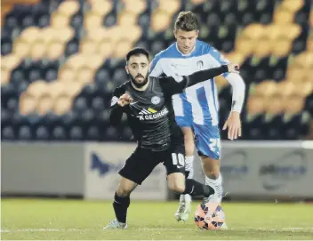  ??  ?? George Moncur (right) playing for Colchester against Posh.