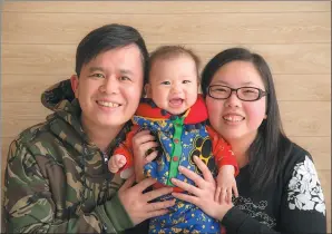  ?? PROVIDED TO CHINA DAILY ?? Sham and his wife Chen Wei-ling with their daughter, June, in February last year.