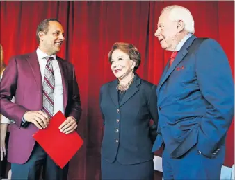  ?? [NATE BILLINGS/ THE OKLAHOMAN] ?? From left, Joseph Harroz Jr., interim president of the University of Oklahoma, talks to Peggy and Charles Stephenson after the announceme­nt Friday of a $20 million gift from the Stephenson­s to the Stephenson Cancer Center, 800 NE 10 St., in Oklahoma City.