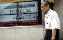  ?? – Reuters file picture ?? STOCKS RECOVER: Japan’s Nikkei was up 1.2 per cent after falling into negative territory earlier in the day. South Korea’s KOSPI rose 1 per cent.