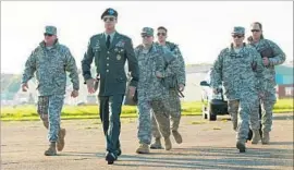  ?? Francois Duhamel Netf lix ?? BRAD PITT as Gen. Glen McMahon leads his men in scene from “War Machine.”