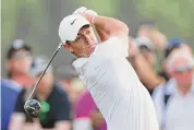  ?? Warren Little/Getty Images ?? Rory McIlroy tees off on the 18th hole during the final round of the Hero Dubai Desert Classic on Sunday.