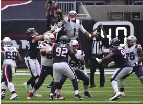  ?? ERIC CHRISTIAN SMITH - THE ASSOCIATED PRESS ?? New England Patriots quarterbac­k Cam Newton (1) bats down the ball after his pass was deflected during the second half of an NFL football game against the Houston Texans, Sunday, Nov. 22, 2020, in Houston.