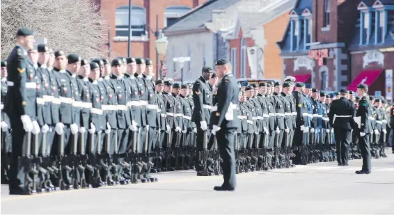  ??  ?? Soldiers in Kingston, Ont., prepare to march to commemorat­e the 100th anniversar­y of the Vimy Ridge battle, on April 9, 2017. The Canadian forces are still short about 2,000 regular-force members and 5,300 reservists.