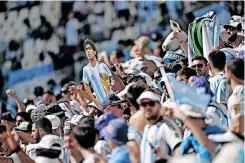  ?? | Reuters ?? AN Argentina fan displays a Diego Maradona cardboard cut-out in the stands before their match against Saudi Arabia.