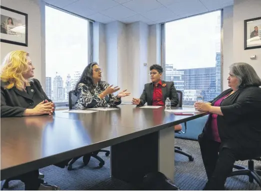  ?? TYLER PASCIAK LARIVIERE/SUN-TIMES ?? Gina Rodriguez, regional administra­tor with the U.S. Department of Labor Women’s Bureau (from left); Sharmili Majmudar, executive vice president of policy, programs and research at Women Employed; Starr De Los Santos, senior coalition manager at Women Employed; and Maria Balderas, executive administra­tive assistant at Chicago Commission on Human Relations, at Women Employed’s offices in the Loop.