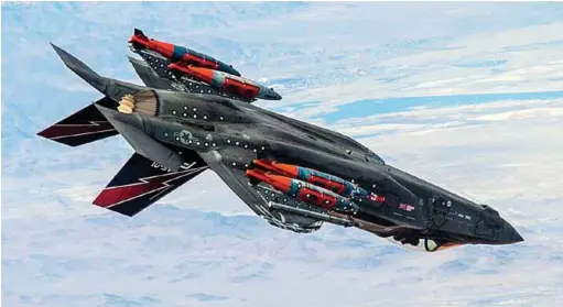  ??  ?? LOCKHEED MARTIN F-35A WITH EXTERNAL GBU-31, 2,000 LB JOINT DIRECT ATTACK MUNITION (JDAM) IN FLIGHT