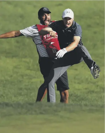  ??  ?? 0 Jordan Spieth bounces off caddie Michael Greller after their chest bump at TPC River Highlands.