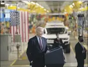  ?? Evan Vucci Associated Press ?? IN DETROIT, President Biden promoted his bills’ gains for automakers, the environmen­t and workers.