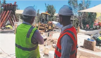  ??  ?? Cr Cameron Caldwell (left) during his tour of Westfield Coomera.