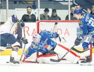  ??  ?? CJ Motte makes a save for the Blaze against the Flames. PHOTO: SCOTT WIGGINS