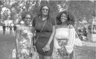  ??  ?? Friends Lakea Saunders, from left, Destiney Stackhouse and Simone Hopwood stand together for a photo at Bushnell Park during Hartford’s Juneteenth celebratio­n.