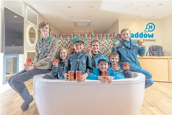  ?? ?? TIN TEAM: Scouts from the 10th Perthshire with some of the beans they have collected.