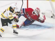  ?? DAVE SIDAWAY ?? Boston’s Brad Marchand puts the puck past Montreal goaltender Carey Price at the Bell Centre last week. Price has a 3.18 goals-against average and a .898 save percentage.