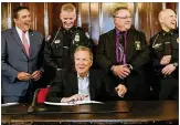  ?? BROOKE LAVALLEY / THE COLUMBUS DISPATCH ?? Ohio Governor John Kasich signed an executiveo­rder in April in hopes of improving criminal background checks for gun purchases.