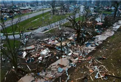  ?? JOSHUA A. BICKEL/ASSOCIATED PRESS ?? Debris was scattered around damaged and destroyed homes Friday in Lakeview, Ohio.