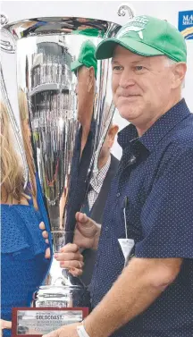  ?? Picture: STEVE HOLLAND ?? Alligator Blood’s part-owner Allan Endresz celebrates on Magic Millions day in January.