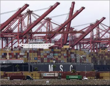  ?? ETIENNE LAURENT — EUROPEAN PRESSPHOTO AGENCY ?? Container ships are docked in the ports of Los Angeles and Long Beach in Southern Califronia in June 2023. The ports were briefly shut down that month amid dockworker­s labor negotiatio­ns. Some port workers have moved to Texas.