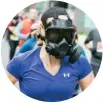  ??  ?? LEFT Jessica Garneau, fastest marathon wearing a gas mask (female), 4:41:46