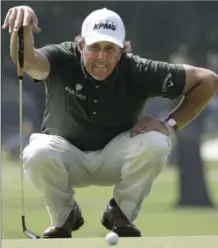  ?? ASSOCIATED PRESS FILE PHOTO ?? Phil Mickelson lines up a putt on the first hole during the second round of the Colonial in Fort Worth, Texas, in May 2010.