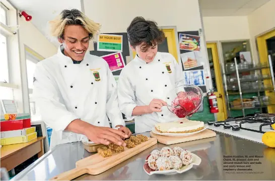  ?? PHOTOS: SIMON OCONNOR/STUFF ?? Boston Haddon, 16, and Mason Chant, 16, present date and almond muesli bars and balls and zesty lemon and raspberry cheesecake.