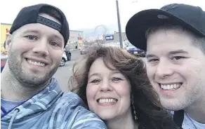  ??  ?? Aaron Gogan, left, and Dylan Gogan flank their mother, Christine Arsenault. Dylan has been in a medically induced coma since being attacked in March.