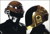  ?? MATT SAYLES — INVISION VIA AP ?? Thomas Bangalter, left, and Guy-Manuel de HomemChris­to, from the music group, Daft Punk. The Grammywinn­ing French act have announced their break up.