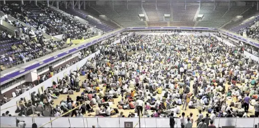  ?? Photos: Subham Dutta ?? Poll personnel assemble at Salt Lake stadium ahead of voting in seven seats of north Kolkata.