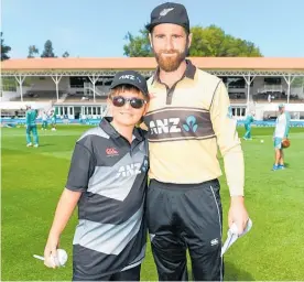  ?? Photos / Photosport ?? Black Cap Kane Williamson with the ANZ Coin Toss winner Leo Alcock.