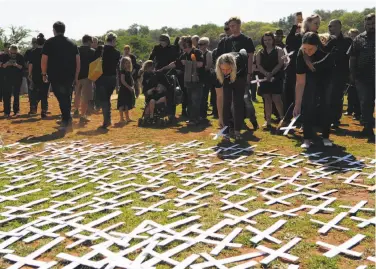  ?? Associated Press ?? People placed white crosses last year representi­ng farm murders at a monument in Pretoria.