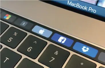  ??  ?? The Macbook Pro’s Touch Bar is an expensive solution in search of a problem.