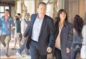  ?? Jonathan Prime Sony Pictures ?? “INFERNO’S” Tom Hanks is once again searching for clues in symbols, this time with Felicity Jones.