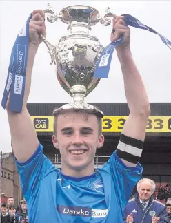  ?? From left: captains Stuart Nelson (Grosvenor Grammar), Michael Lowry (RBAI) and Declan Cassidy (St Mary’s, Magherafel­t) celebrate their teams’ victories in St Patrick’s Day Schools Cup finals ??