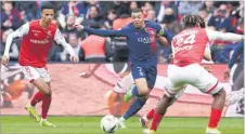  ?? Picture: REUTERS ?? Paris St Germain’s Kylian Mbappe in action with Stade de Reims’ Amir Richardson.