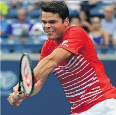  ?? VAUGHN RIDLEY/GETTY IMAGES ?? Milos Raonic plays a shot against Jared Donaldson during Raonic’s 6-2, 6-3 win at the Rogers Cup at the Aviva Centre on Thursday in Toronto to advance to the quarter-final.