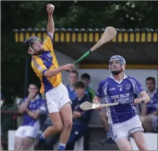  ??  ?? Cathal Doyle of Taghmon-Camross catches the ball despite the close attention of Rory Reville (Our Lady’s Island).