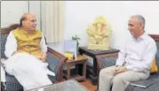  ?? PTI PHOTO ?? ▪ Union home minister Rajnath Singh with former director of the IB and current Kashmir interlocut­or in New Delhi on Monday.