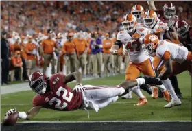  ?? DAVID J. PHILLIP - THE ASSOCIATED PRESS ?? FILE - In this Jan. 7, 2019, file photo, Alabama’s Najee Harris reaches for the end zone during the first half the NCAA college football playoff championsh­ip game against Clemson, in Santa Clara, Calif.