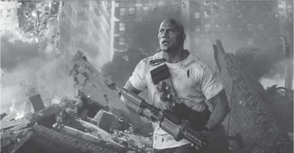  ?? PHOTOS: WARNER BROS. ?? Is this San Andreas’ fault or someone else’s, maybe Jumanji’s? Dwayne Johnson seems to get his action movies a little mixed up in Rampage.