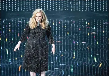  ?? MONICA ALMEIDA/THE NEW YORK TIMES ?? Adele performs during the 85th Academy Awards ceremony at the Dolby Theatre in Los Angeles on February 24, 2013. The British singer this year joined the list of richest people in the UK.